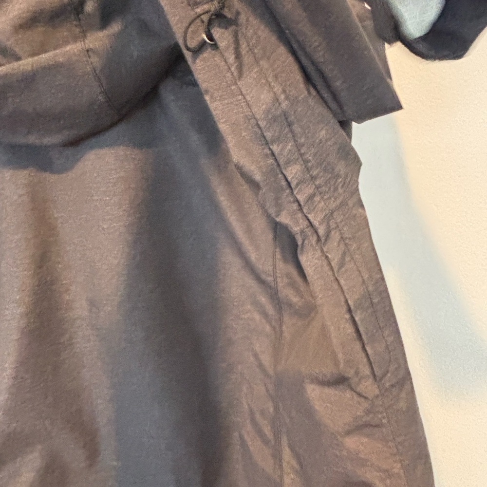 The North Face Charcoal Gray Rain Parka with gold zipper. - Picture 7 of 8